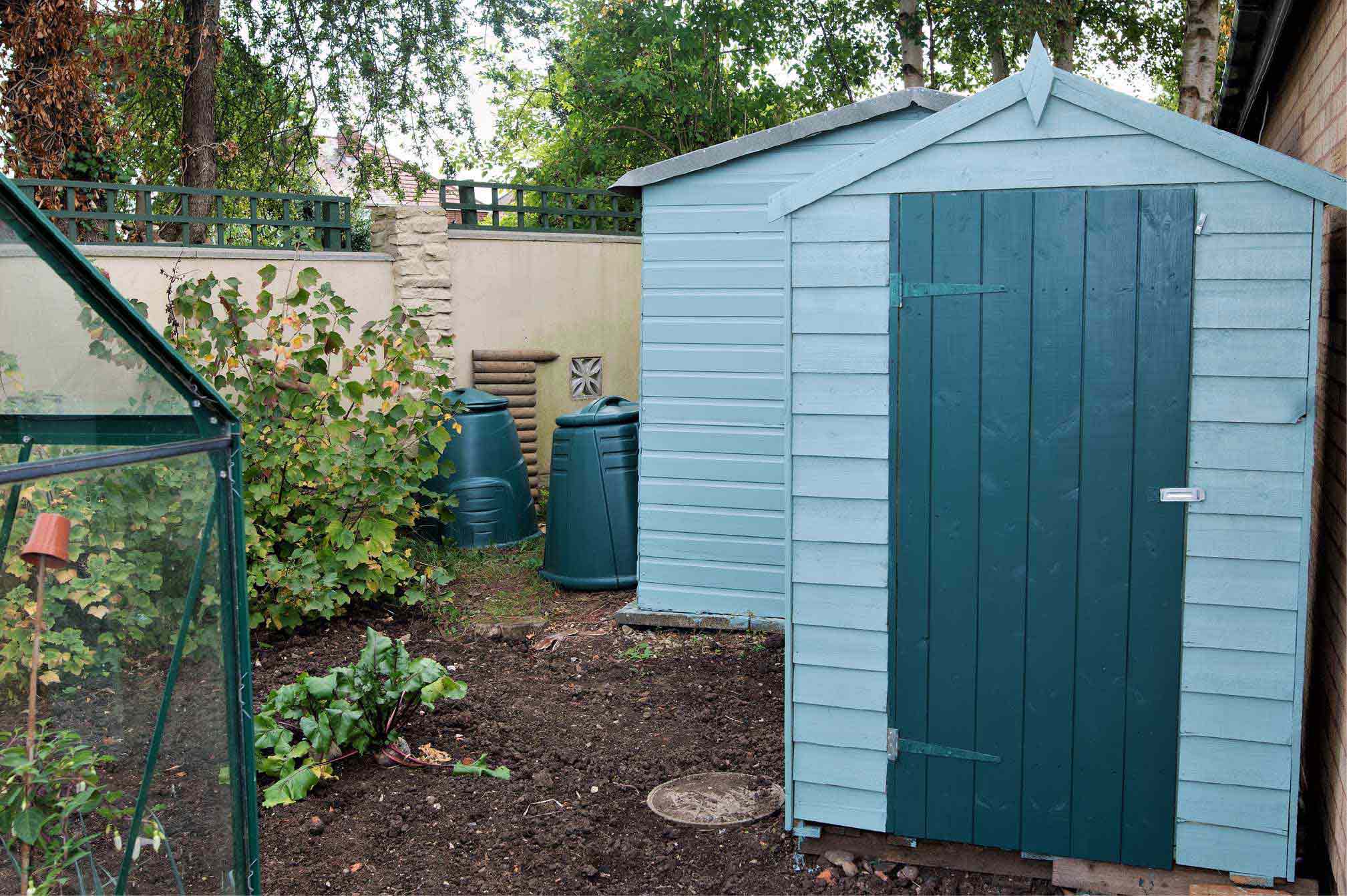 Picture of blue garden shed in British garden